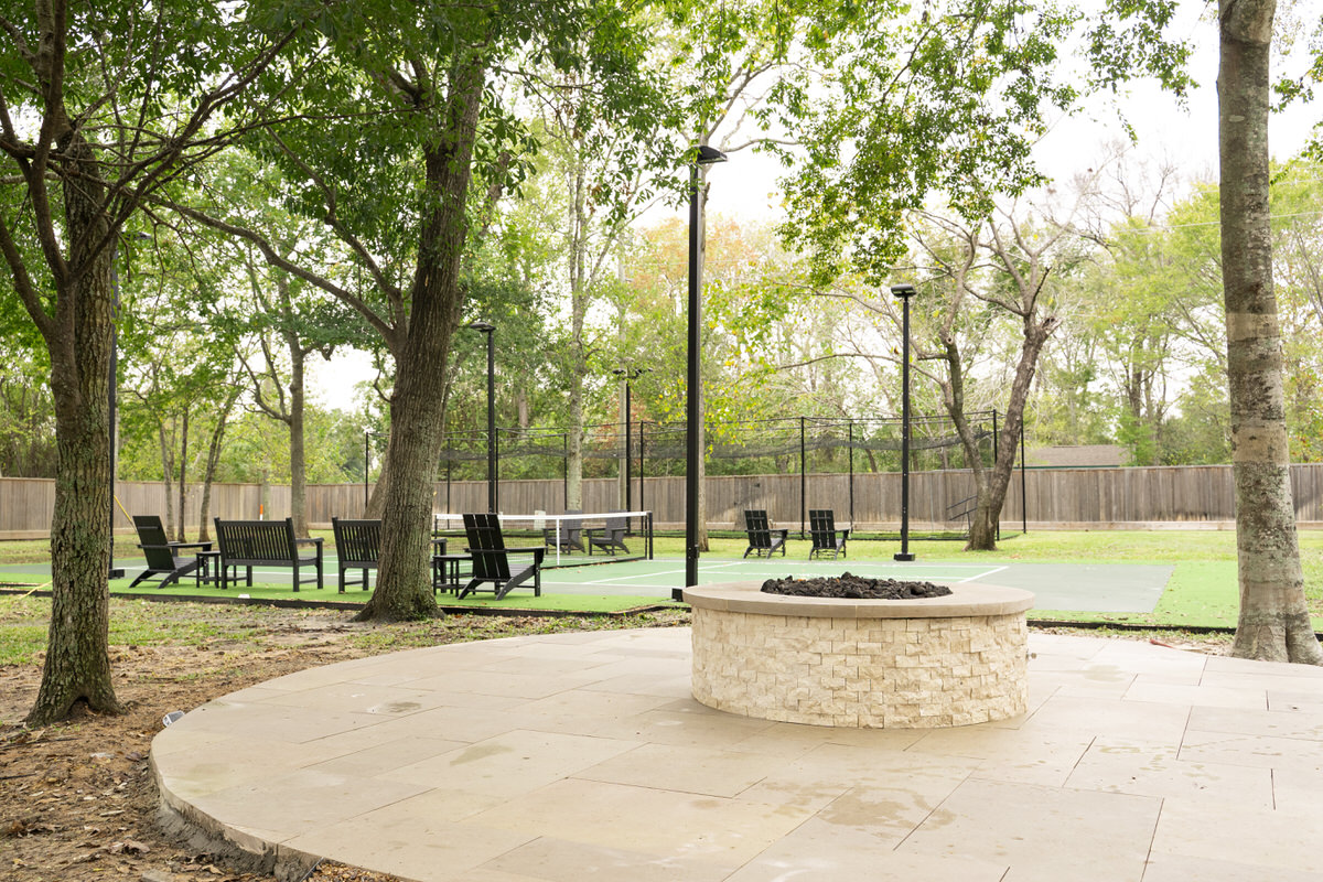 Stone fire pit on a travertine patio
