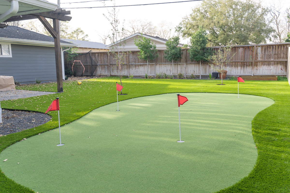 Backyard putting green with flags